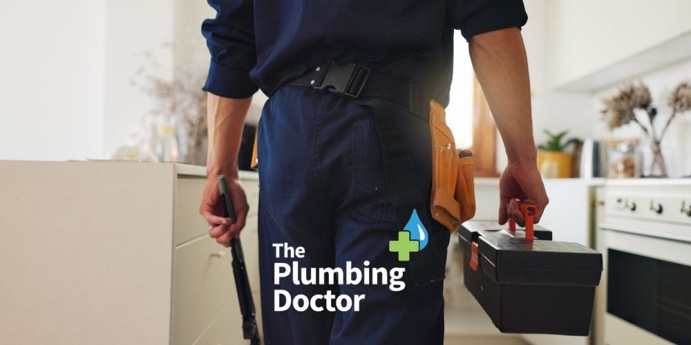 How to Find a Local Plumber - Plumber with Tool Box and Logo - The Plumbing Doctor